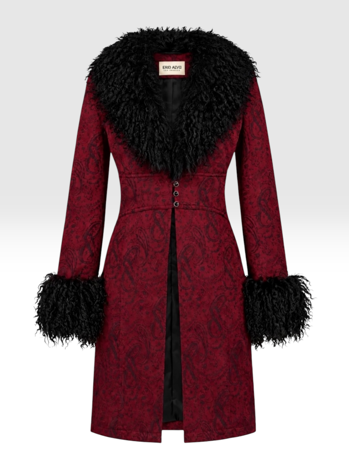 A long red patterned coat with a large black Mongolian -fur collar, black cuffs, and  front opening, shown on a  white  studio background. A  neck label reads Erin Alva Los Angeles .